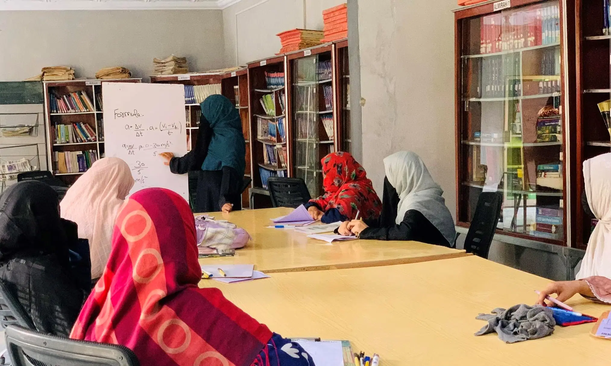 Teachers and students engaged in a classroom environment